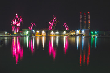 Lighting Giants - colorful illuminated cranes at night in Pula, Istrian Peninsula in Croatia