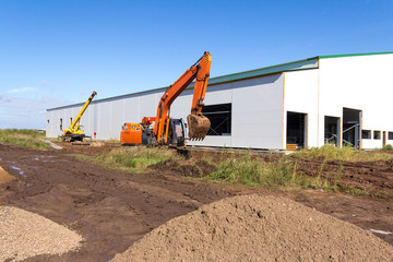 Obraz premium Construction equipment. Large tracked excavator at the construction site