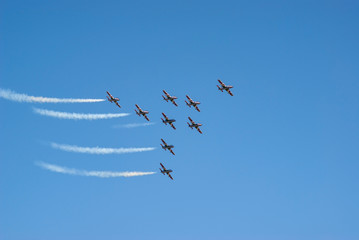Squadron of military airplanes flying in formation