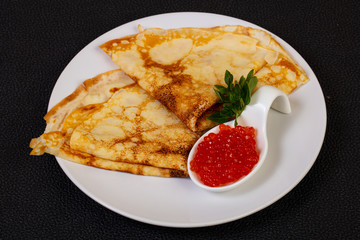 Pancake with red caviar