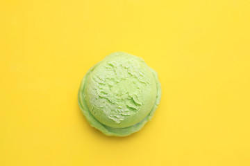 Ice-cream scoop on bright sunny background, copy space. Summer vacation, refreshment, traditional seasonal cold sweets