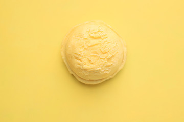 Ice-cream scoop on bright sunny background, copy space. Summer vacation, refreshment, traditional seasonal cold sweets