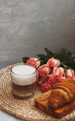 Vertical view of a coffee break with roses