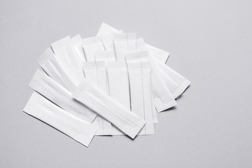 Set of white disposable packaging for snacks, food, sugar and spices. Sachets for medicines