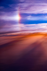 Fototapeta na wymiar 飛行機からの雲の上の風景