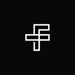 Fototapeta premium Minimal elegant monogram art logo. Outstanding professional trendy awesome artistic FT TF initial based Alphabet icon logo. Premium Business logo White color on black background