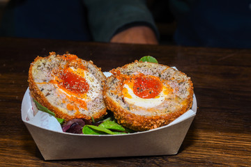 A Scotch egg soft or hard-boiled egg