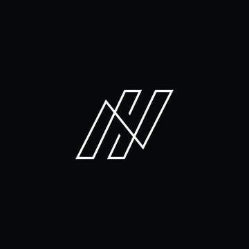 Minimal elegant monogram art logo. Outstanding professional trendy awesome artistic NH HN initial based Alphabet icon logo. Premium Business logo White color on black background
