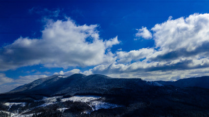 Carpathian mountains mountain range pine forests coniferous mountain tops winter snow aerial photography