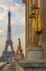 Paris, France - 04 25 2020: View of the Eiffel Tower from the Trocadero esplanade and golden women statues during the coronavirus period