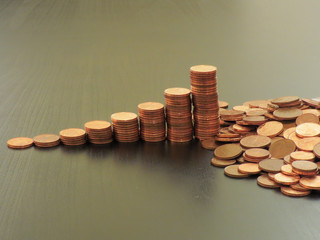 Coins on a table. Euros on a table, coins close-up. Savings in coins. Grow your savings. Stack of Coins. Growing Money.