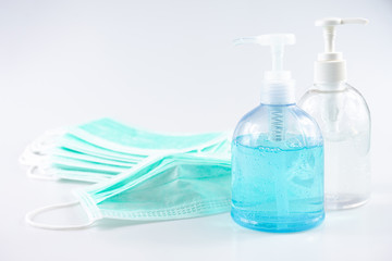 Coronavirus disease (COVID-19) prevention set, medical surgical face masks and hand sanitizer gel for hand hygiene, health care concept.
