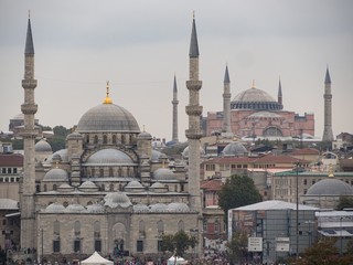 Fototapeta na wymiar Sultan Ahmed Mosque And Hagia Sophia Against Cloudy Sky