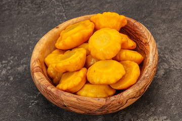 Marinated yellow patisson in the bowl