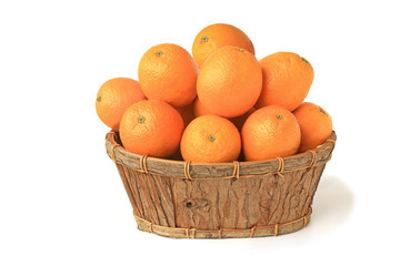 Oranges in a wooden basket isolated on white