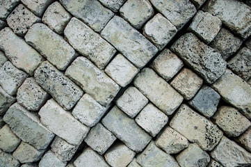 folded building blocks. background of hewn smooth stones