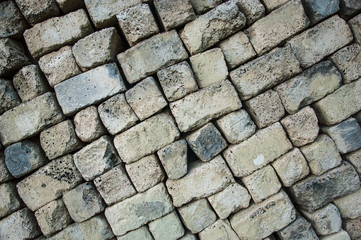 folded building blocks. background of hewn smooth stones