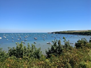 Boats in water near Poole, Dorset on the Jurassic Coast near Old Harry Rocks