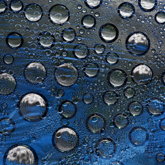 White-gray spheres with black halo are located on a gray-blue background. Cosmic abstraction. 