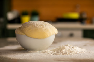 Fresh bread dough on white  kitchen table