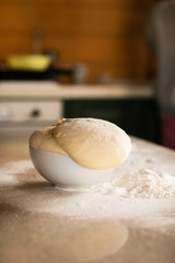 Fresh bread dough on white  kitchen table