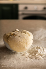 Fresh bread dough on white  kitchen table
