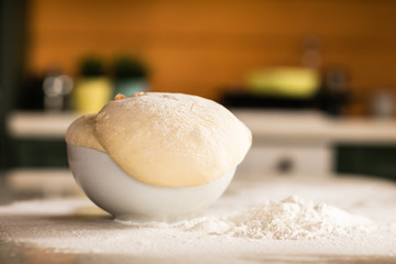 Fresh bread dough on white  kitchen table