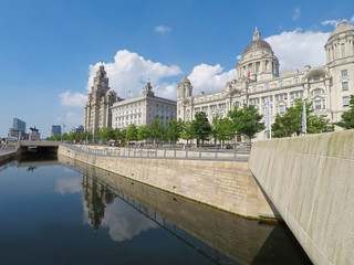 Fototapeta na wymiar Liverpool's waterfront with the iconic Liver Birds, Three Graces, cathedrals and other landmarks on the River Mersey. UNESCO World Heritage Site status was bestowed 2004.