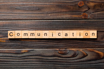 COMMUNICATION word written on wood block. COMMUNICATION text on wooden table for your desing,...