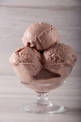 Strawberry ice cream in a flask on a light background