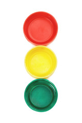 Top view of colorful plastic bottle caps isolated on white
