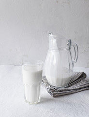 Probiotic cold fermented dairy drink. Fresh plain homemade yougurt (yogurt, youghurt, kefir, ayran, lassi) in glass, copy space. 