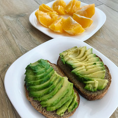 Avocado toast and sliced orange