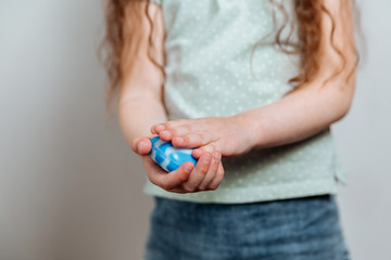 The girl avenges her hands with soap.