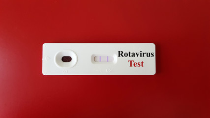 Positive Rotavirus test with sample of testing in rapid kit test for screening and diagnosis rota virus infection disease on background. Medical and infectious investigation concept
