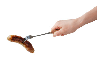Hand holding barbecue fork BBQ sausage