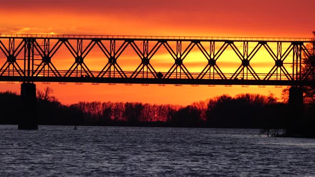 Railway bridge over the river at the stunning dawn