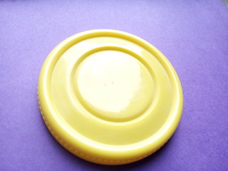 yellow plastic on plane surface