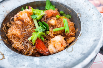 Baked shrimp with vermicelli in tureen, Thailand.