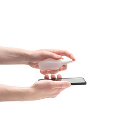 Mobile phone disinfection isolated on a white background. Men's hands cleans the phone with a sanitizer. Prevention of coronavirus, covid-19.