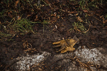 Abandoned and forgotten glove on the ground.