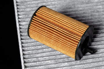 Car engine filter on dark background.