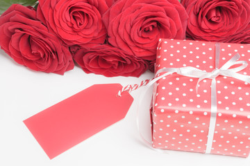 Blank card, gift box with red roses