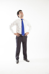 Young corporate office man looking up visioning future of work front view isolated on white background