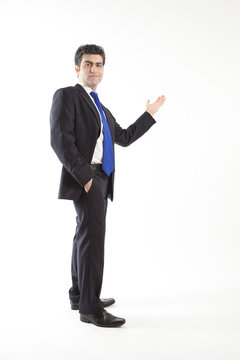 Young business man presenting with blank background