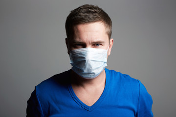 Man in Mask. Epidemic of Coronavirus concept