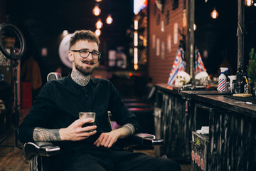 barbershop. portrait of a moustachioed barbershop master in the workplace