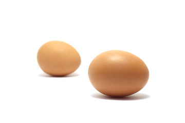 Two chicken eggs isolated on white background