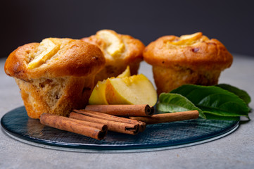 Fresh baked muffins with apple and cinnamon close up