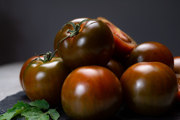 Fresh ripe sweet reddish brown and green kumato tomatoes